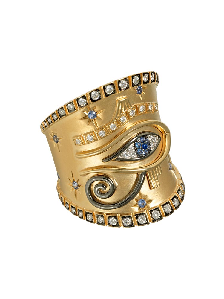 Eye of Horus ring in yellow gold set with blue sapphires and diamonds